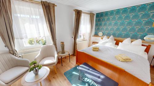 a bedroom with a large bed in a room at Goldener Engel /Pension in Görlitz