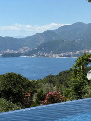 a view of a large body of water from a house at Sunset Residence Blizikuce in Budva
