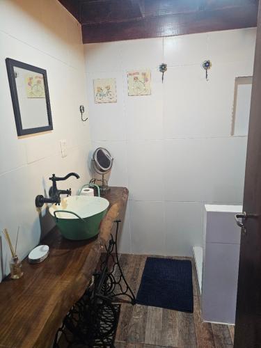 a bathroom with a sink on a wooden counter at Don Vito Casa de Huespedes in Cucullú