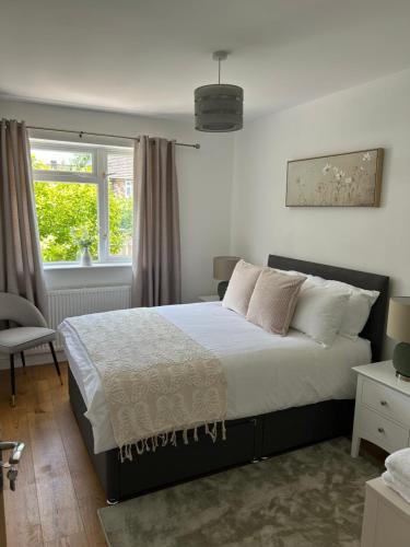 a bedroom with a bed and a window at Northway Apartment's in Oxford