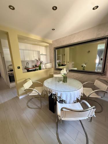 a dining room with a table and chairs at Villa Magnifica in Mostar