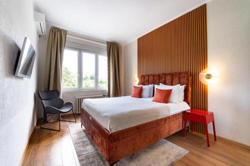 a hotel room with a bed and a window at Belgrade CITY CENTER Apartments PARKING 12e - 7 min by walk TERAZIJE in Belgrade