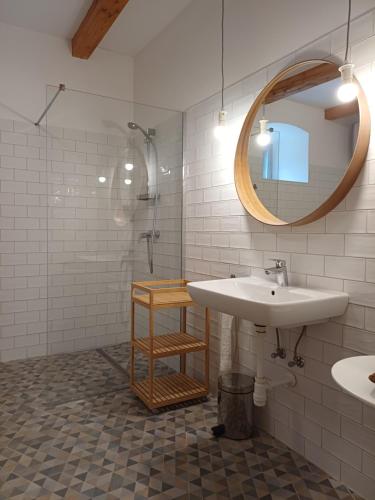 a bathroom with a sink and a mirror at Füveskert in Erdőbénye