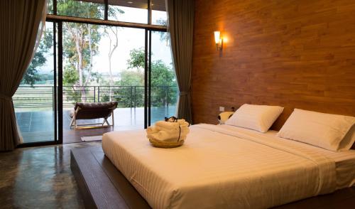 Ένα ή περισσότερα κρεβάτια σε δωμάτιο στο Pagoda Sight Residence