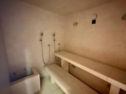 a bathroom with a shower and a bath tub at Corredor Suite - Eira Building - Santa Marta in Santa Marta