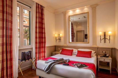 Postel nebo postele na pokoji v ubytování Hotel Villa Glori