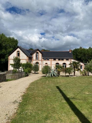 a large house with a yard in front of it at Château L'Escale in Saint-Herblon