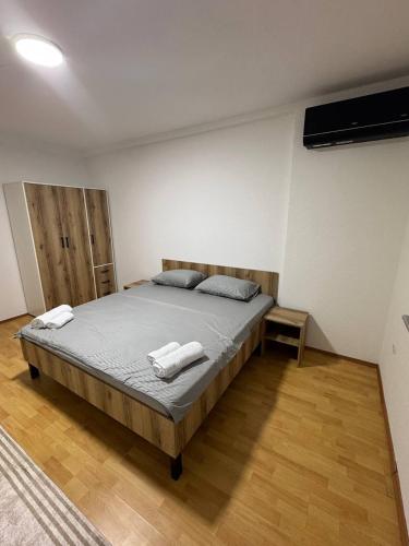 a bedroom with a bed with two pillows on it at DrimResidence in Struga