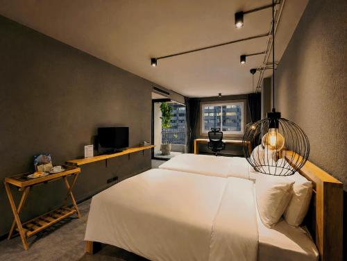 เตียงในห้องที่ โรงแรมเซ็นทริคเพลส