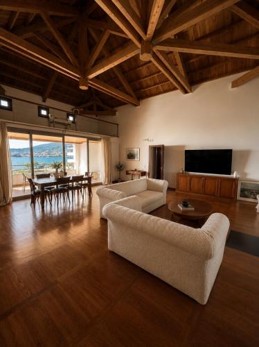 a large living room with a couch and a table at Sea & Salt ,Pelion,Agria Volos in Agria