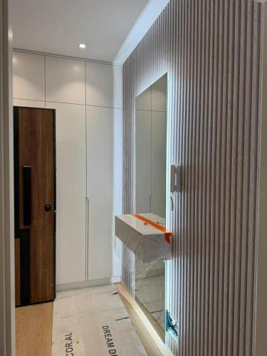 a bathroom with a sink and a mirror at Apartment 51 Luxury in Kamëz