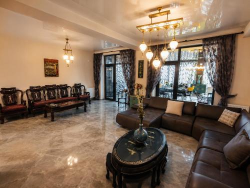 a living room with a couch and a table at Villa MD Grigoleti in Grigoleti