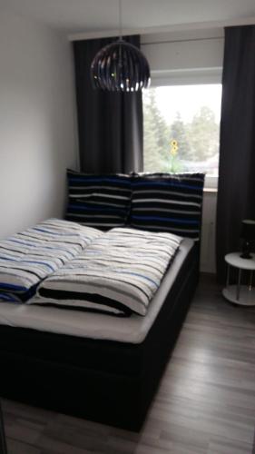 Postel nebo postele na pokoji v ubytování Ferienwohnung Am Steinberg