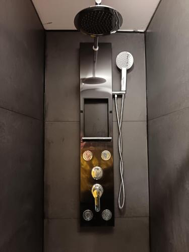 a shower in a bathroom with a fan at Dover White Cliff Apartment in Dover