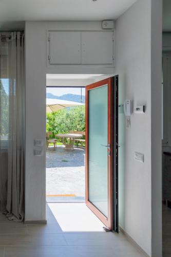 an open door with a view of a patio at Casa Flavia in Lierna