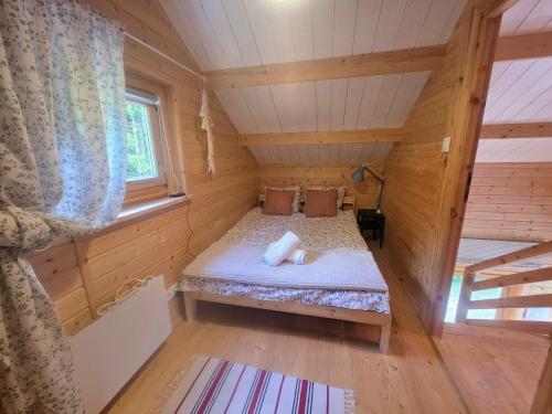 an overhead view of a bedroom in a log cabin at Mazury na Miedzy in Orzyny