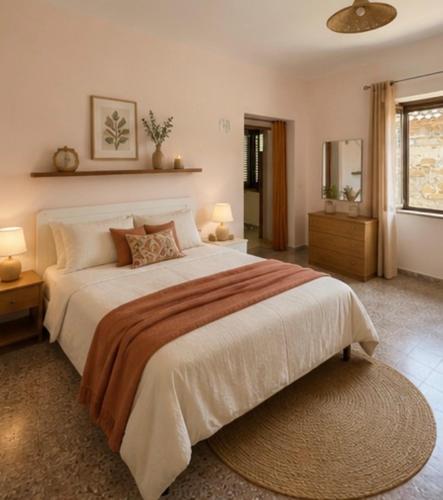a large bedroom with a large bed and a window at Casa Vacanze Panoramika Santa Cruz - Appartamento PANORAMIKA in Cicerale