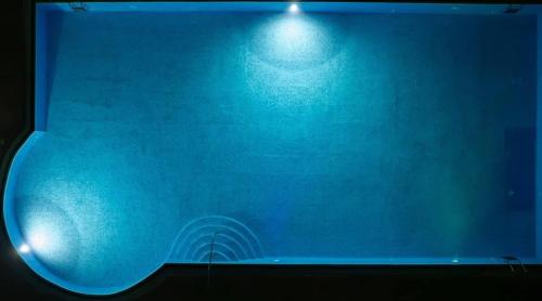 a blue stage with a light on top of it at Q Hotel in Neptun