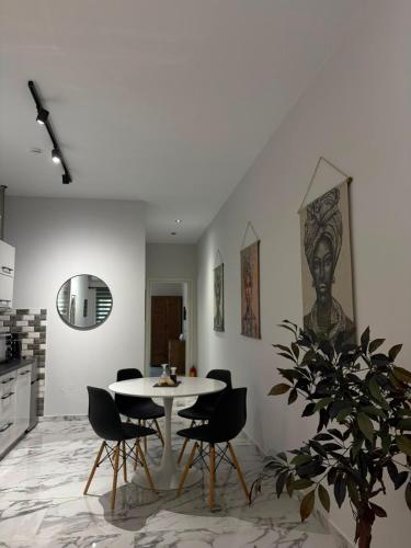 a dining room with a table and chairs at Vt Homes in Corfu