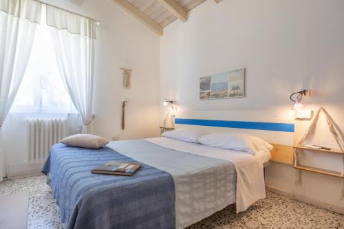 a bedroom with a bed with a tray on it at La collina sui trabocchi in Ortona