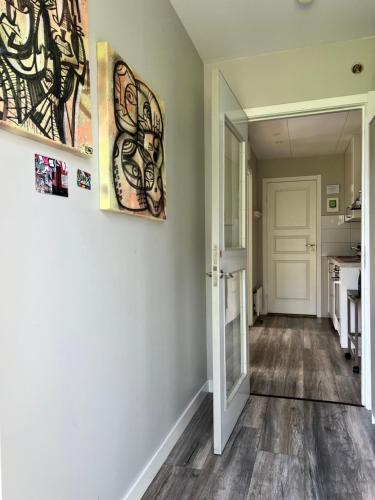 an empty room with a hallway with a kitchen at Sköna Rum Fryksta in Kil