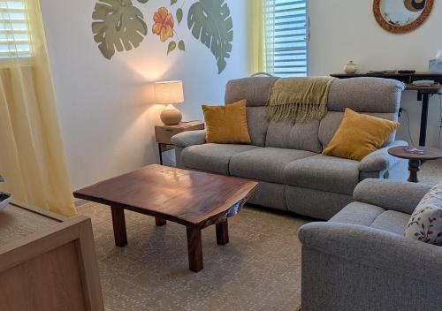 a living room with a couch and a coffee table at Sun Seekers Retreat 3 bedrooms in Santa Maria