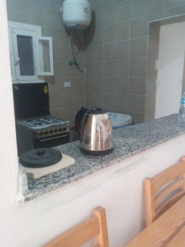 a kitchen with a tea kettle on a counter at HASH # SAAd in Marsa Matruh
