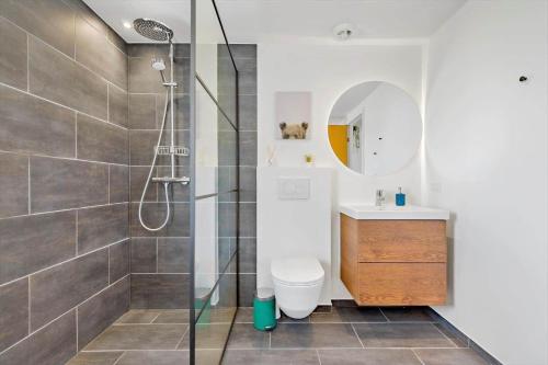 a bathroom with a shower and a toilet and a sink at 8599-Glesborg-Amagervej-4 in Glesborg