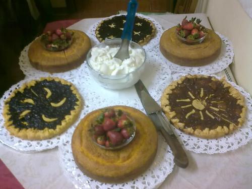 a bunch of pies on plates on a table at Agriturismo Antica Golena in Guastalla