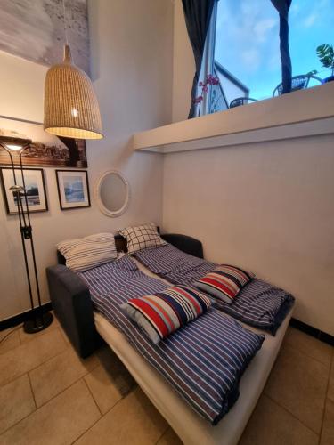 a bed with pillows on it in a room at Nice appartment in city center Gol,free Wifi and electric in Gol