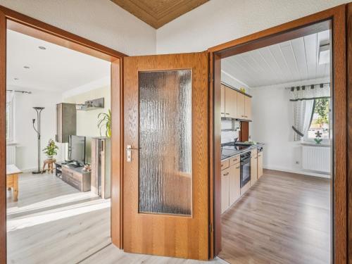 a kitchen with a door open to a kitchen with a kitchen at Frida in Lichtenhain