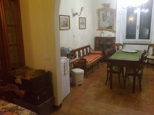 a living room with a table and a dining room at Agriturismo Antica Golena in Guastalla