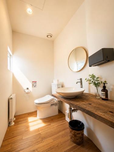 a bathroom with a sink and a toilet at Haus128 in Sapporo