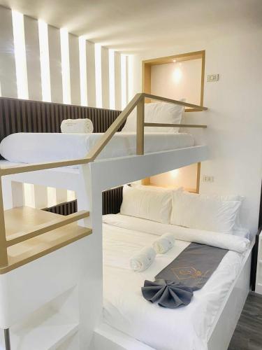 a couple of bunk beds in a room at Grospe Resort Boracay in Boracay