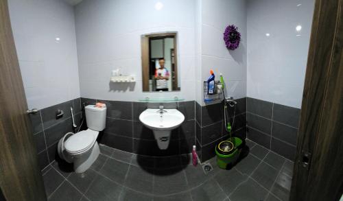 a bathroom with a toilet and a sink at Moon bay 384 in Ðoan Xá