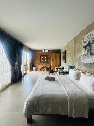a large bedroom with a large bed in a room at The balangan studio room 7 in Bingin Beach