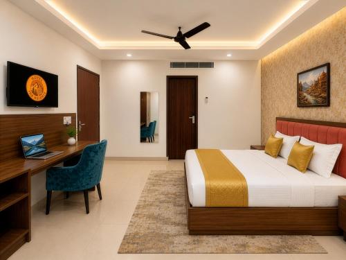 a hotel room with a bed and a desk at Hotel The Heights in Haridwār