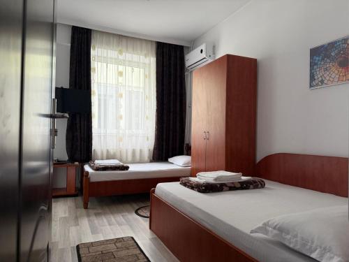Un pat sau paturi într-o cameră la Complex Eforie