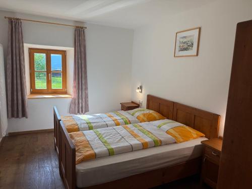 a bedroom with a bed and a window at Unterwegerhof in Tires