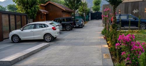 a group of cars parked on a driveway at The Meer Mansion in Srinagar