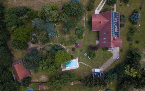 an overhead view of a house with a swimming pool at Mihály Kulcsos Vendeghaz in Őriszentpéter