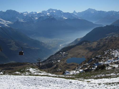 a ski lift on top of a snowy mountain at Apartment in Fieschertal with Swiss Alps Views in Fieschertal