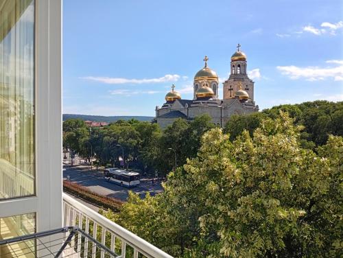a view from a balcony of a building with gold domes at Grand Central Varna in Varna City