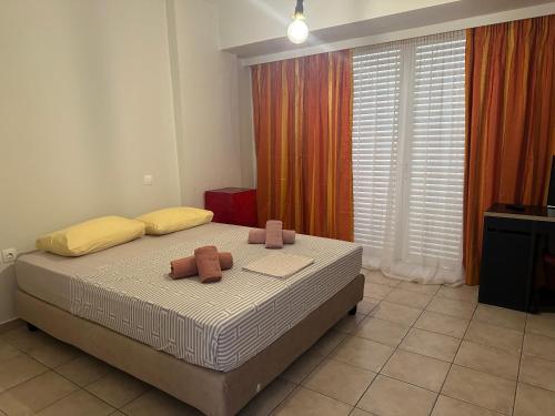 a bedroom with a bed with two teddy bears on it at The salty studio in Rethymno