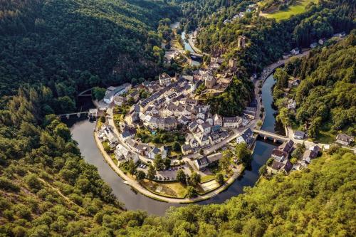 an aerial view of a small village on a river at Hébergement atypique in Esch-sur-Sûre