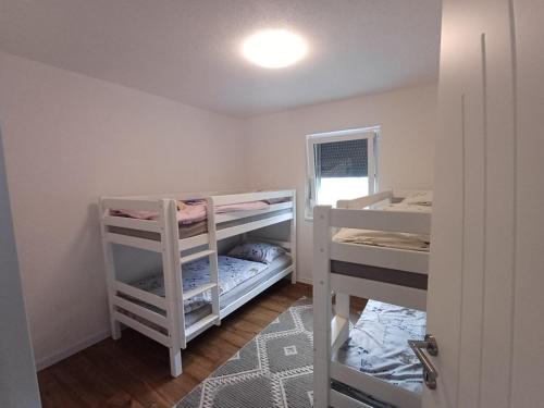 a small room with two bunk beds in it at Villa Una Verde in Bosanska Krupa