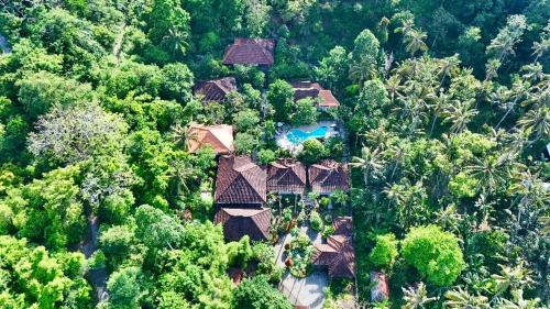 an aerial view of a house in the forest at DW Jungle Resort - Candidasa in Candidasa
