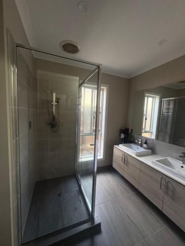 a bathroom with a shower and a sink at Park Views Guest Room in Kilmore