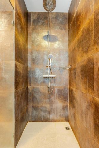 a bathroom with a shower with a glass door at Private pool villa in Kamala Beach