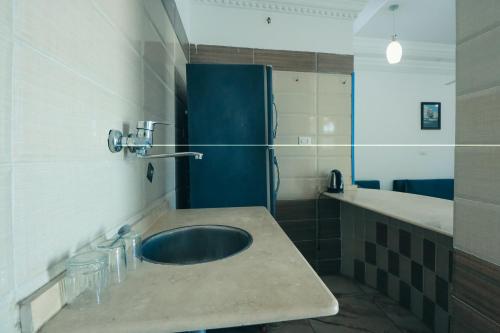 a bathroom with a sink and a shower at Luxor Guest House in Luxor